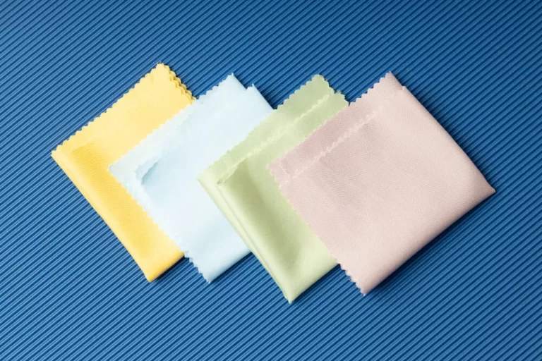 four microfiber clothes are placed on the blue culored cloth